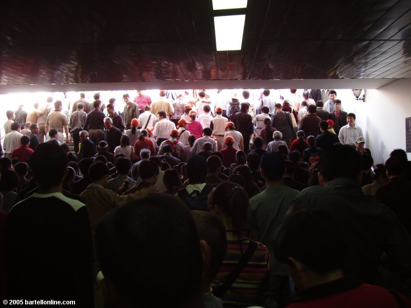 Crowd exiting underground walkway in Beijing, China
