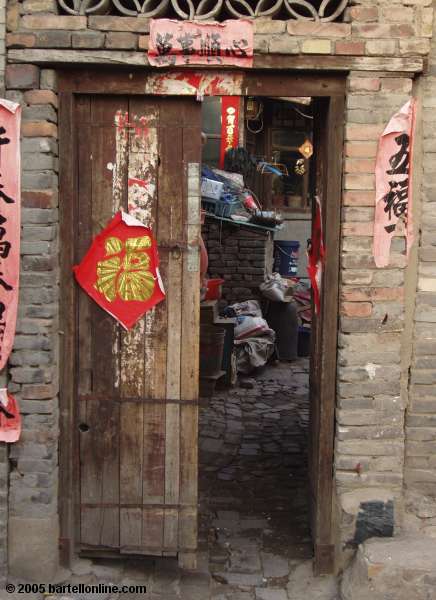 Doorway in alley in old section of Hohhot, Inner Mongolia, China