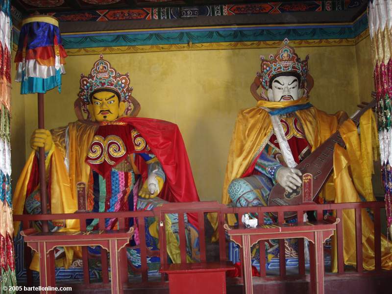 Figures guarding gateway at Dazhao Temple in Hohhot, Inner Mongolia, China