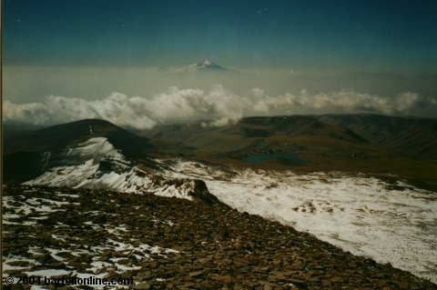 Kari lake and peaks of Mt. Ararat as seen from south peak of Mt. Aragats, Armenia
