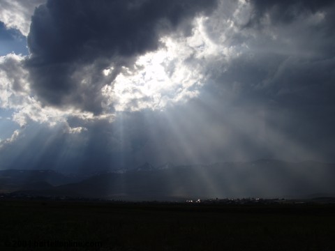 Sunrays illuminating Aragats-Aparan village, Armenia with Mt. Aragats in the distant background
