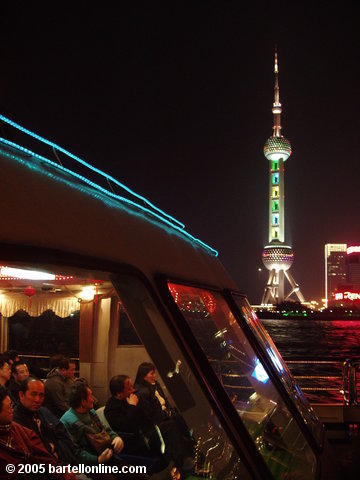 View of the Oriental Pearl TV Tower in Pudong, China as seen from a tour boat on the Huangpu river