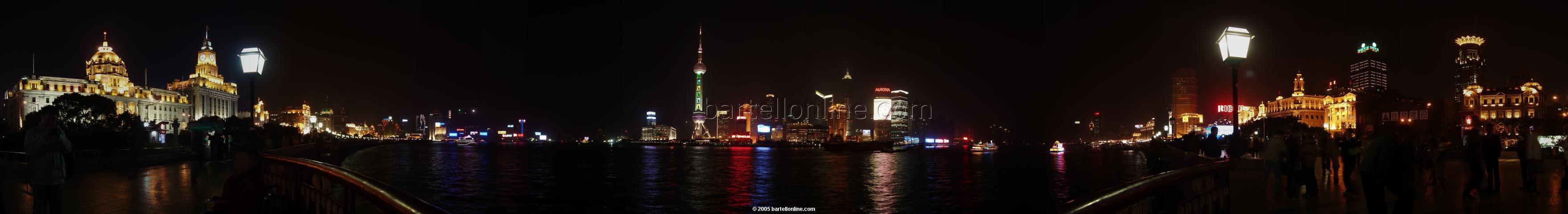Night panorama of Huangpu river and Pudong seen from The Bund in Shanghai, China