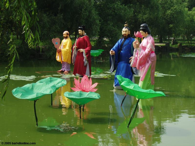 Figures in a pond in Beiling Park, Shenyang, Liaoning, China