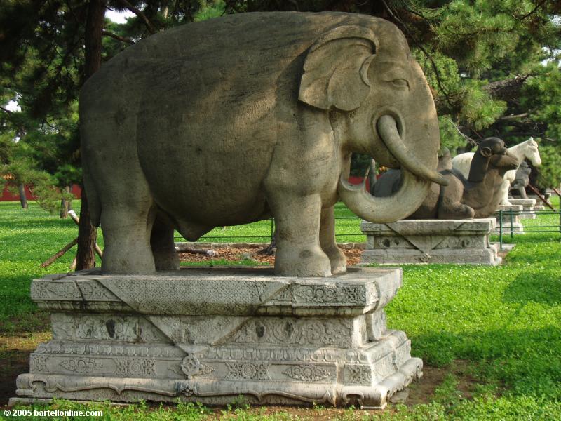 Stone animals line a walkway inside Zhaoling Tomb in Beiling Park, Shenyang, Liaoning, China