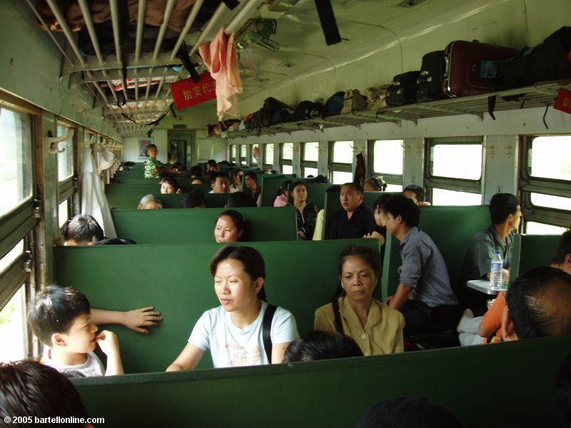 Interior of a typical hard seat car on a passenger train in China