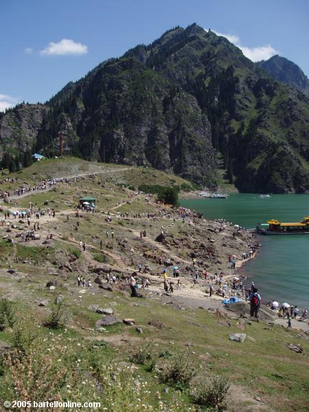 Day tourists crowd the north shore of Tianchi Lake in Xinjiang province, China