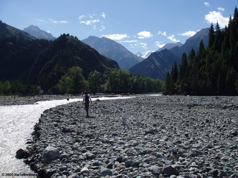 Hiker along the river off the south end of Tianchi Lake in Xinjiang province, China