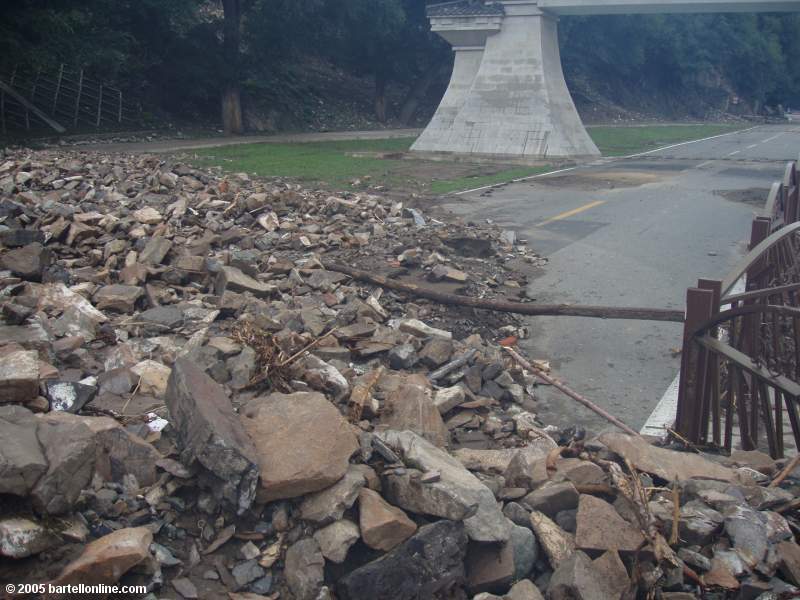 Washed-down rubble blocks the road out of Tianchi Lake in Xinjiang province, China