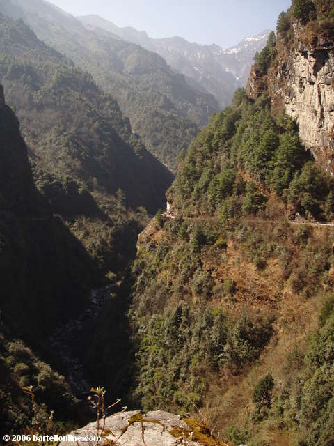 The "Cloudy Tourist Road" winds into and out of a valley in the Cangshan mountains above Dali, Yunnan, China