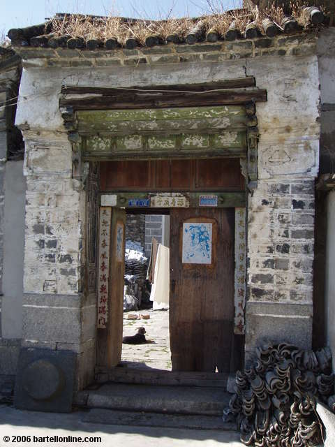 Doorway and courtyard of a home near the Three Pagodas outside Dali, Yunnan, China