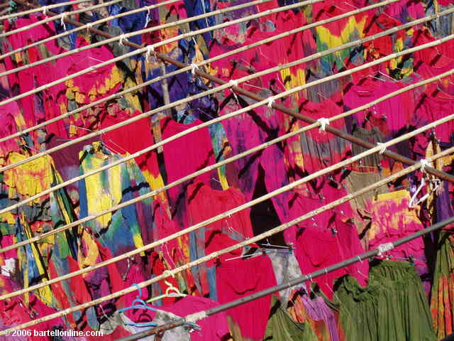 Racks of tie-dyed clothing dry at a factory in a village outside Dali, Yunnan, China