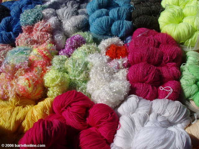 Colorful yarn for sale at the Youshuo market in Yunnan province, China