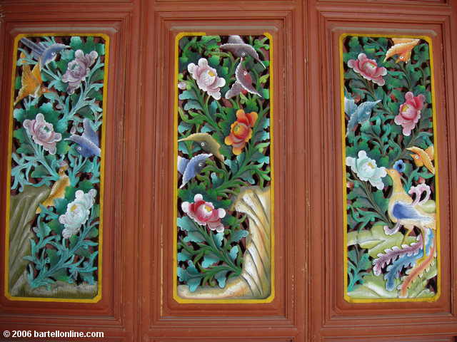 Colorful woodwork at the Zhonghe Temple in the Cangshan mountains above Dali, Yunnan, China