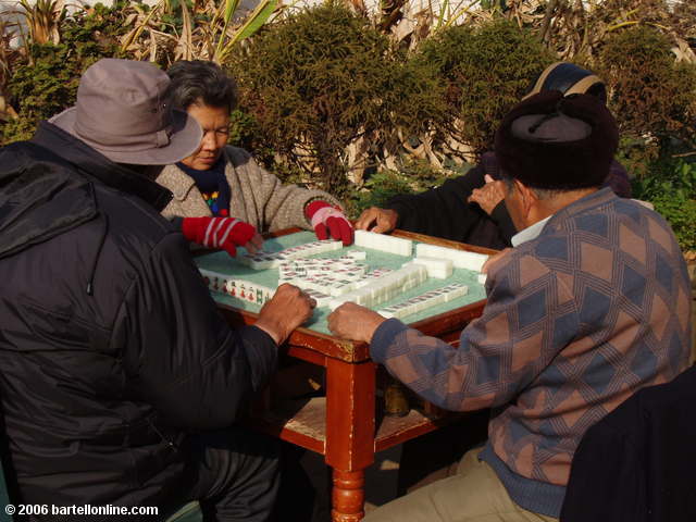 Mahjong players in a park at the foot of the East Pagoda in Kunming, Yunnan, China