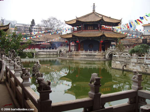 An octagonal temple to Guanyin rises from a pool inside Yuantong Temple in Kunming, Yunnan, China