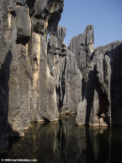 Limestone karsts surround the Sword Pool at the Stone Forest near Kunming, Yunnan, China