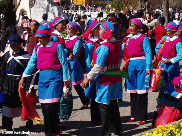 Dancers in minority costumes seen in the Old Town section of Lijiang, Yunnan, China