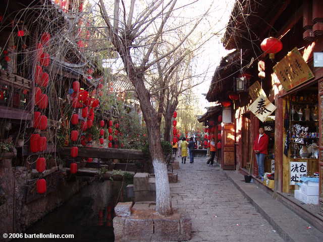 Souvenir shops along a canal in the Old Town of Lijiang, Yunnan, China