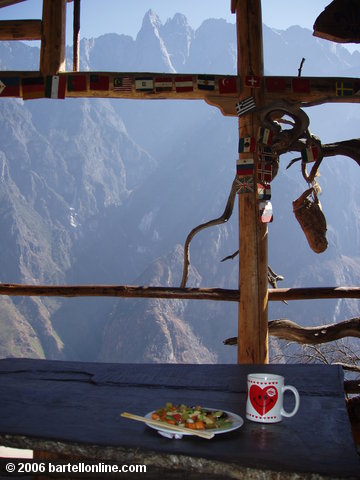 Lunch of stir fried vegetables with a view of Jade Dragon Snow mountain from the Halfway Guesthouse at Tiger Leaping Gorge in Yunnan, China