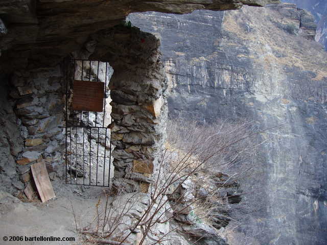 A "toll gate" operated by local trail maintainters blocks a path into Tiger Leaping Gorge in Yunnan, China